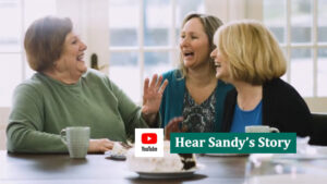 women laughing together at table