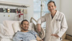 Dr. David Conti stands next to a patient