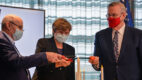 Left to right: Drew Weissman, MD, PhD, Katalin Karikó, PhD, and Barney Graham, MD, PhD light a candl