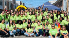 Med students from the Family Medicine Interest Group pose in green Project MedSCOPE tshirts at the 19th annual New Jerusalem Home of the Saved Church's Community Block Party in Albany