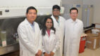 Dr. Wei Sun and his team standing for a photo in his lab