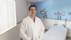 Matthew DiCaprio, MD, director of Orthopedic Oncology, standing in an empty patient room