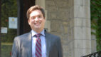 Endocrine and general surgeon Timothy Ullmann, MD, standing outside on a porch on a sunny day