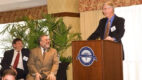 The 2010 Albany Prize recipients on stage. From left, Eric S. Lander, PhD, David Botstein, PhD, and at the podium, Francis S. Collins, MD, PhD