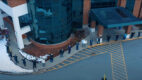 Employees of Glens Falls Hospital waving at a drone camera outside of the hospital