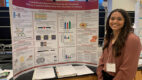 Carsyn Bonesteel stands in front of a poster describing her research