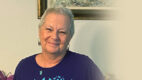 joyce Casertino posing in an Ovarian Cancer Awareness Month tshirt