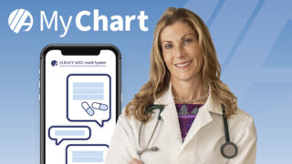 MyChart image with smiling health care provider and a phone screen featuring communication iconography.