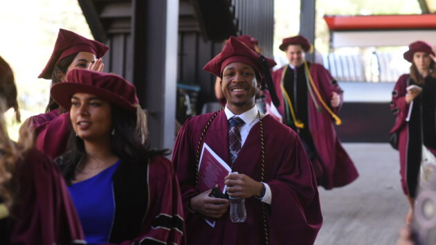 Graduates walking down a ramp at the 2024 Albany Medical College Commencement ceremony