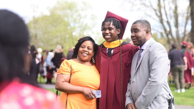 Albany Medical College Class of 2024 graduate with his family at the Commencement ceremony