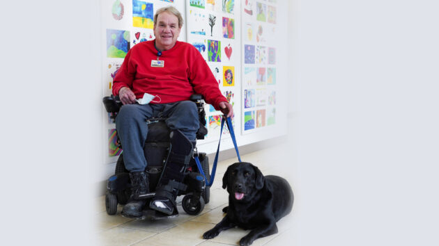 Volunteer Jeff Cooper with his dog at Glens Falls Hospital