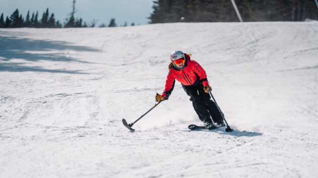 Kelsey O'Driscoll skiing down a mountain slope.