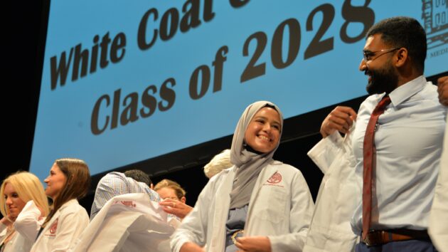 Medical students don their white coats for the first time at the Class of 2028 White Coat Ceremony