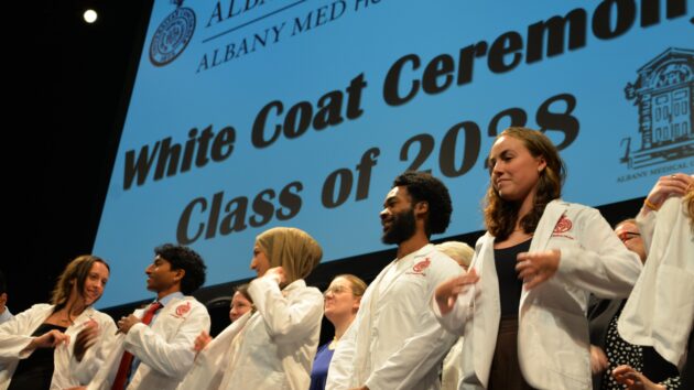 Medical students don their white coats for the first time at the Class of 2028 White Coat Ceremony