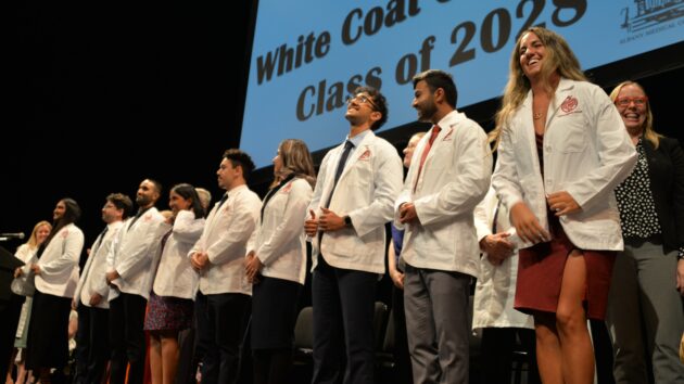 Medical students don their white coats for the first time at the Class of 2028 White Coat Ceremony