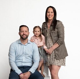 family posing for a portrait