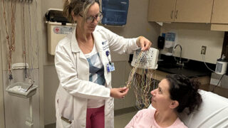 Women demonstrating an EEG test.