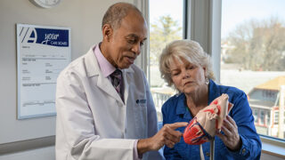 Dr. Adam Clinton with a patient