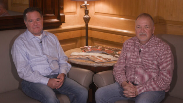 Robotic transplant surgery patient Stephen Smith (right) sits next to his friend and kidney donor John Church (left).