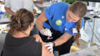 An Albany Medical Health System volunteer administers a flu vaccine