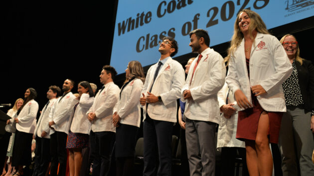 Medical students don their white coats for the first time at the Class of 2028 White Coat Ceremony