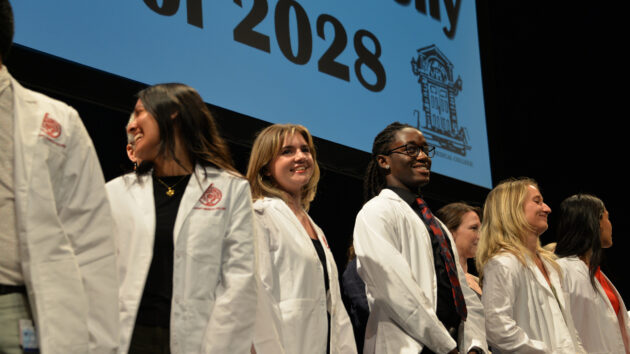 Medical students don their white coats for the first time at the Class of 2028 White Coat Ceremony