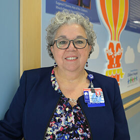 Dr. Barbara Ostrov standing in a hallway