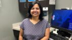 Dr. Aparajita Chaudhuri standing in a patient room