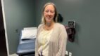 Dr. Cara Grimes posing in a patient room