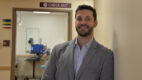 Urologist Dr. Michael Pignanelli standing in a clinic hallway