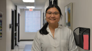 Endocrinologist Dr. Susan Demarest standing in a clinic hallway