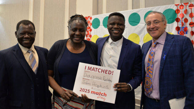 A medical student stands with his parents and the dean of Albany Medical College at Match Day 2025